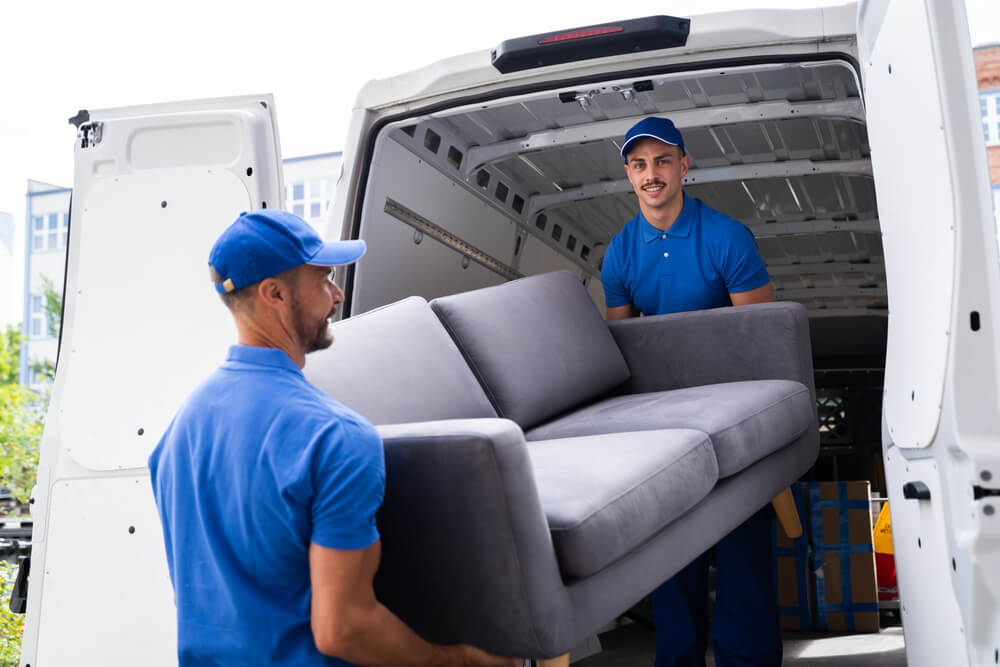 Movers Securing Items In A Moving Truck